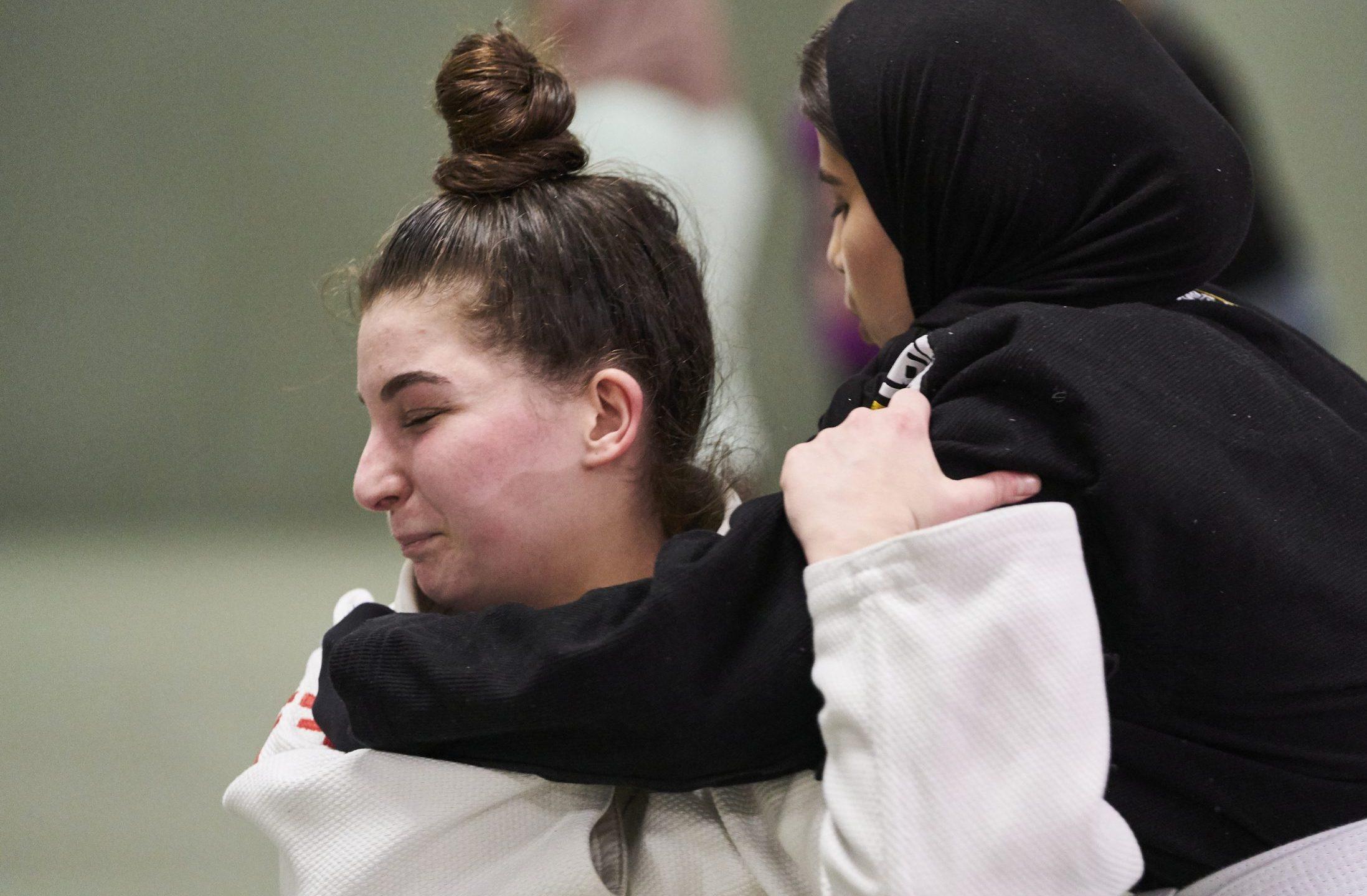 Two women practicing martial arts