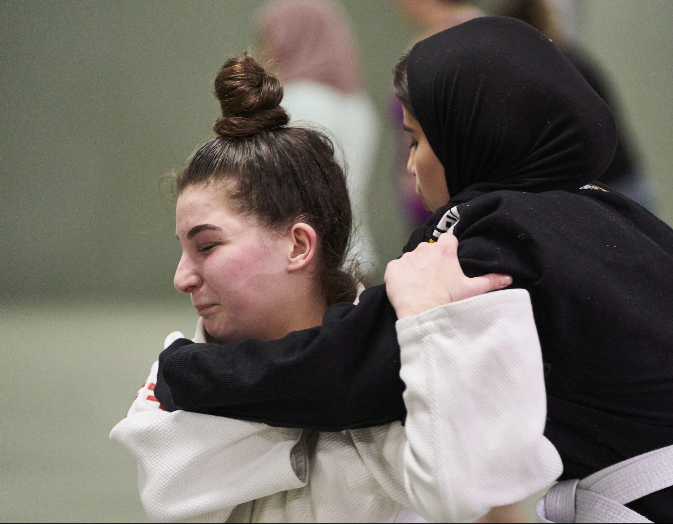 Two women practicing martial arts