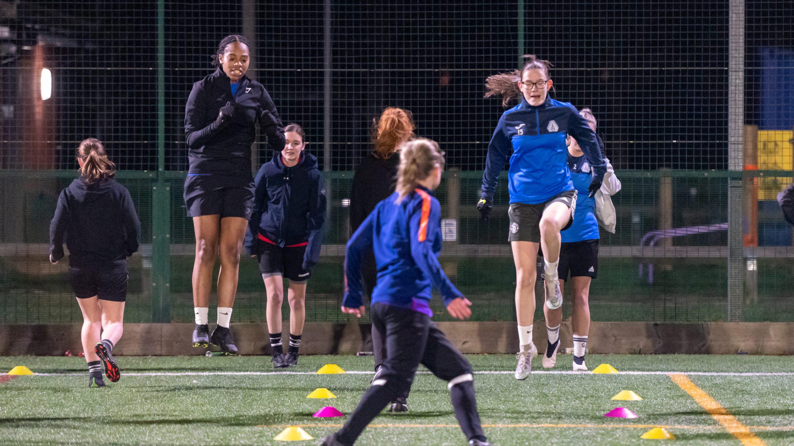 Women's football club training at night