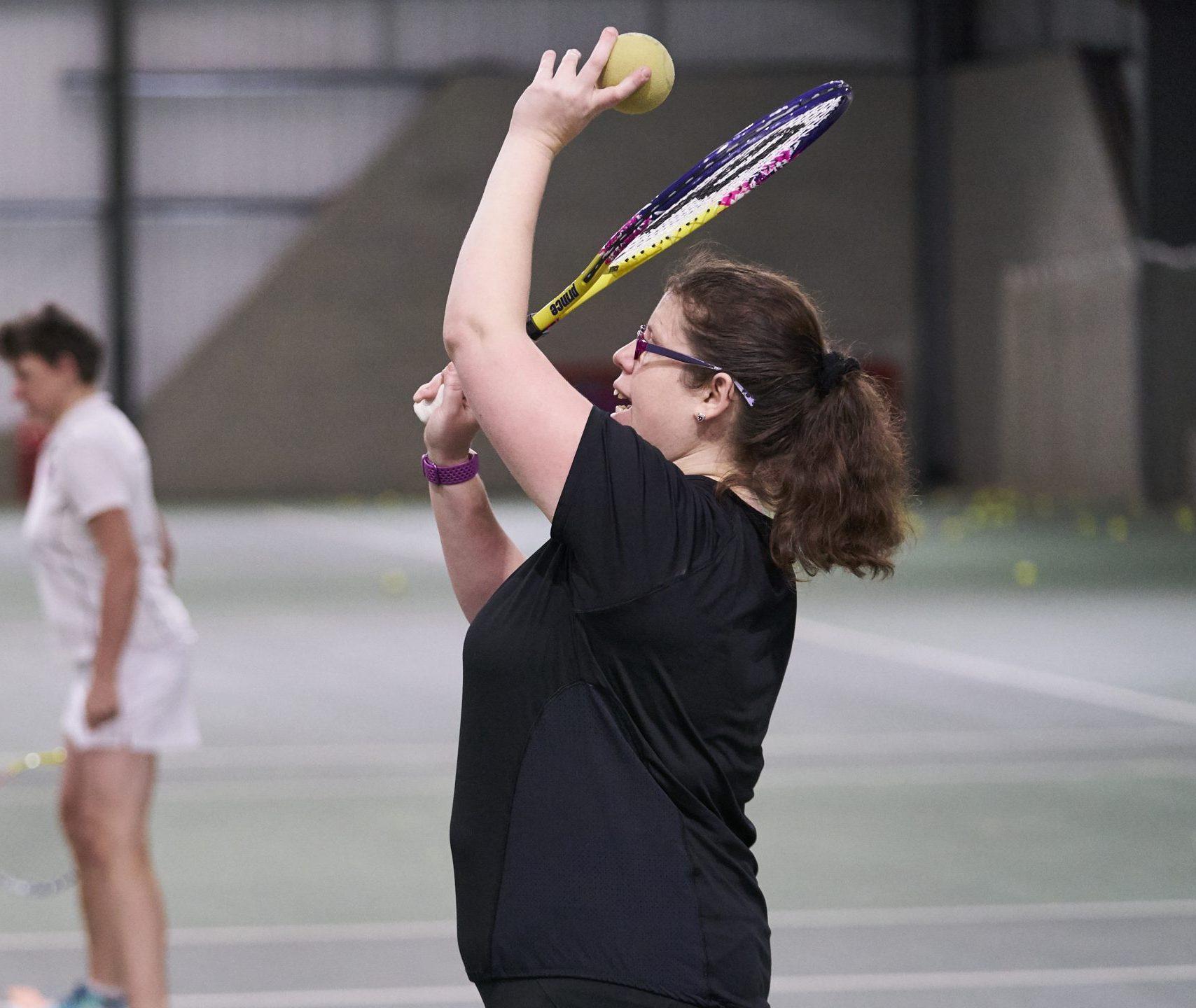 Disabled woman playing tennis