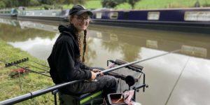 A teenage girl fishing at a canal