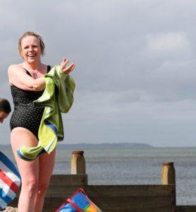 Catherine, a 52 year old woman drying off after a swim in the sea