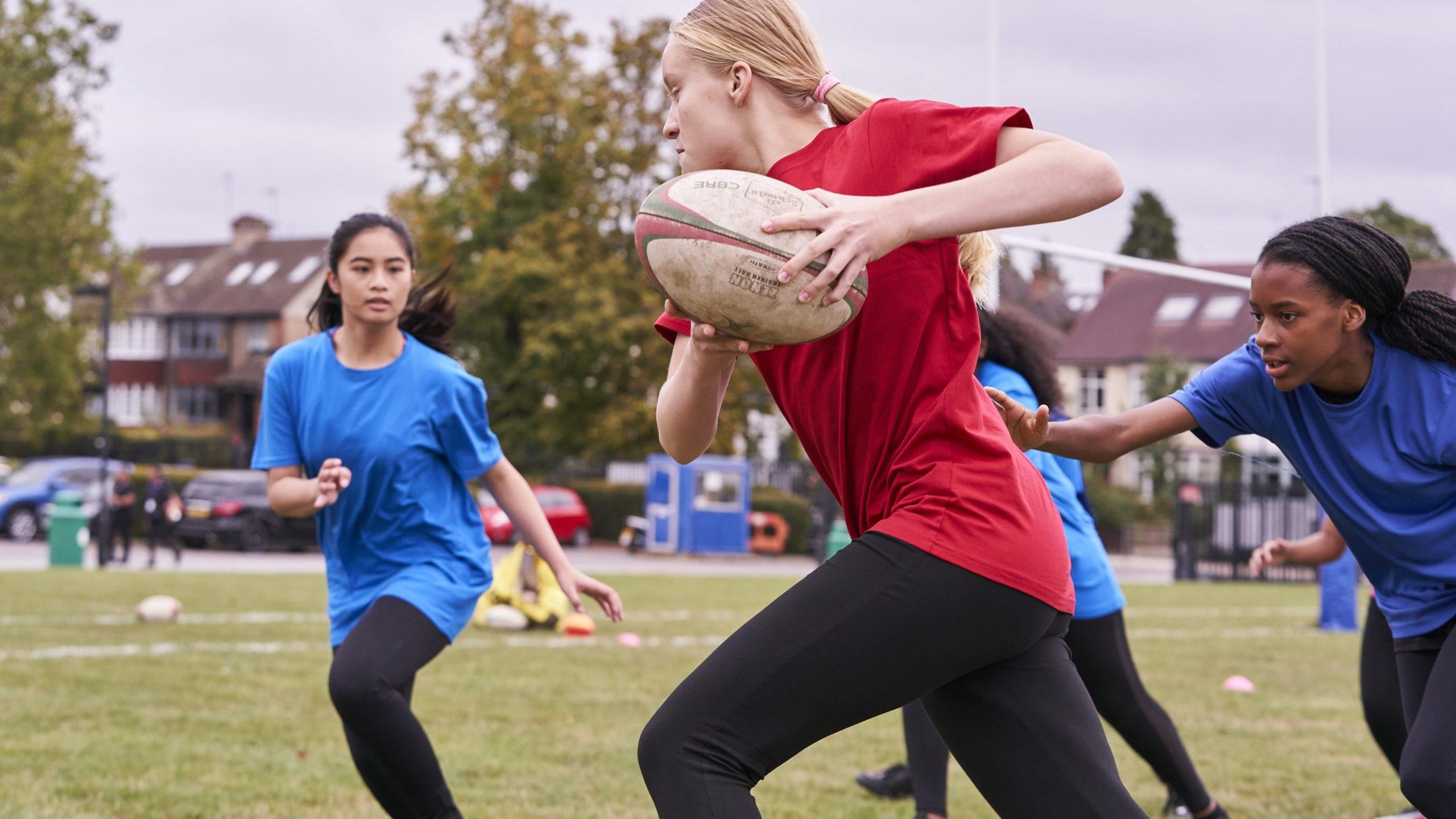 Girls playing rugby