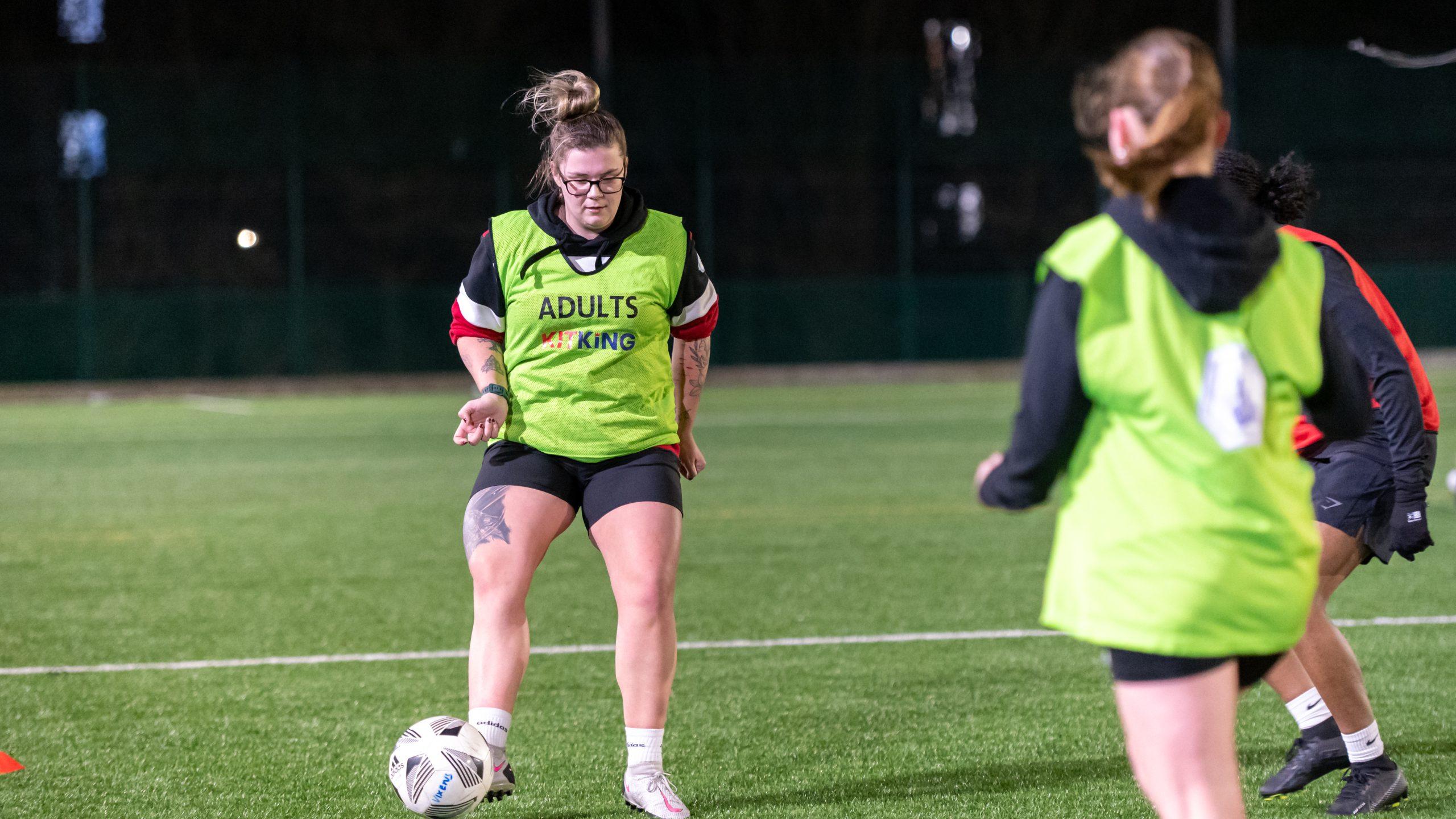 A group of women and girls playing football