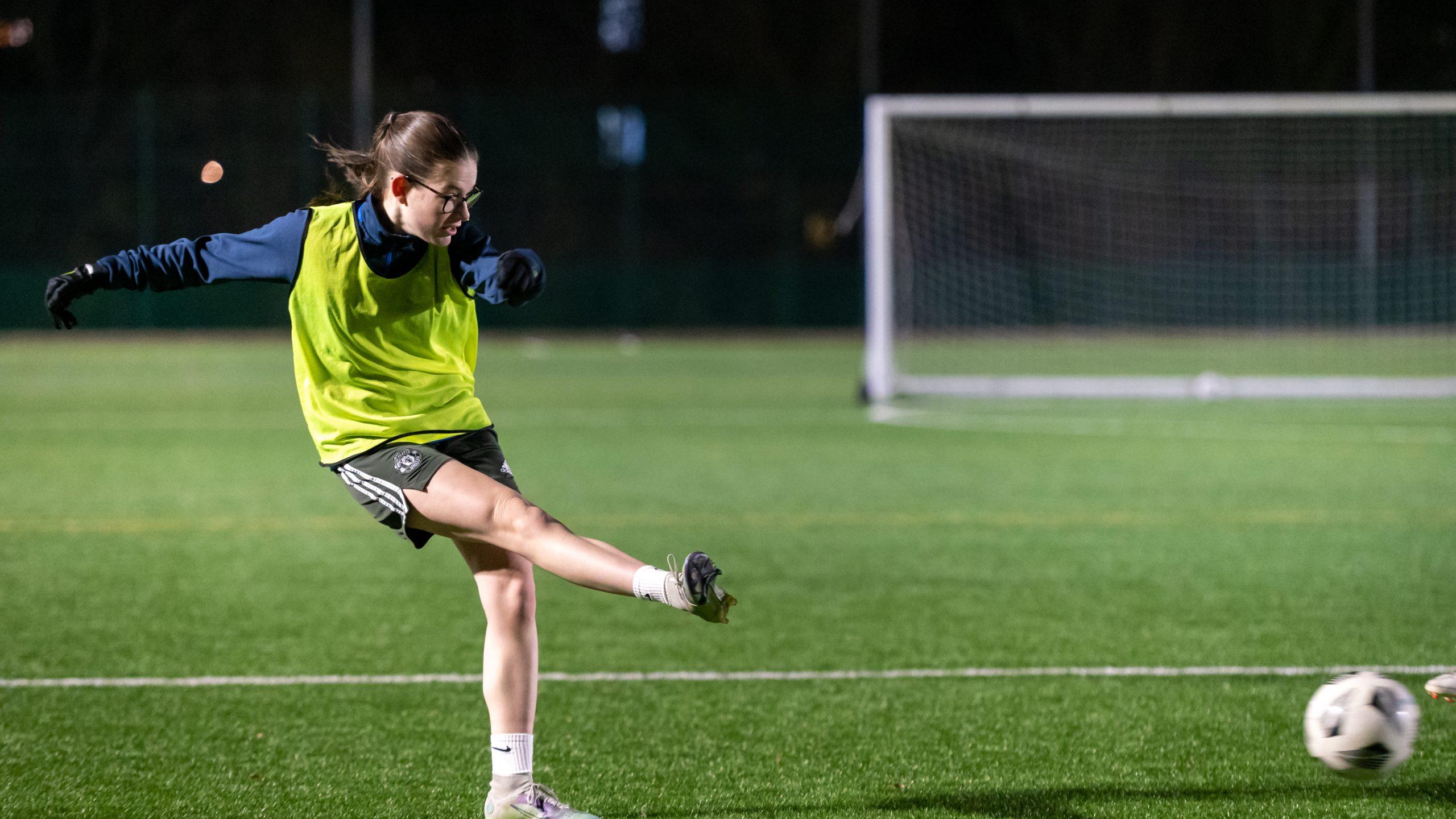 Young woman playing football