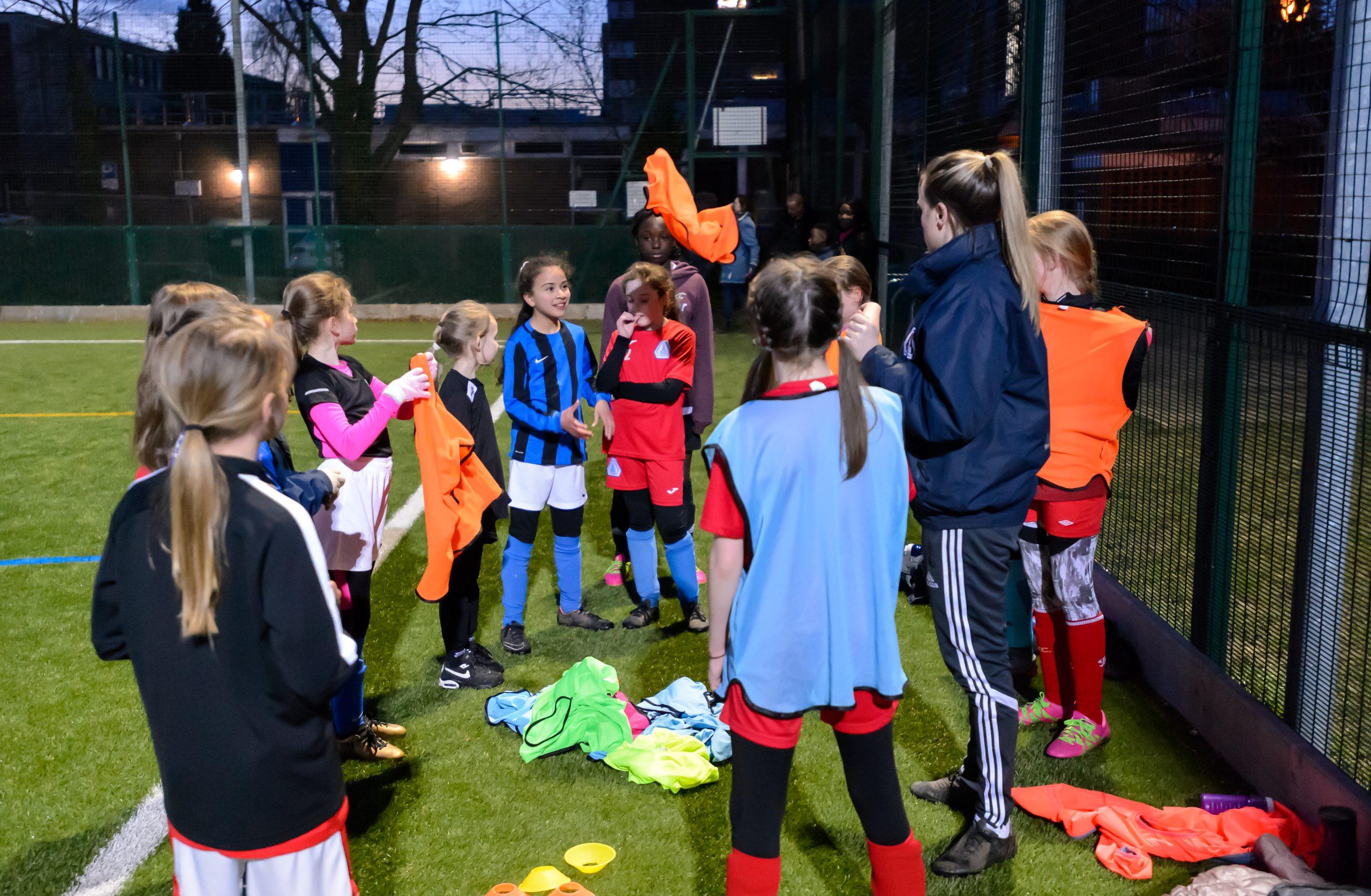 Young girls at football practice