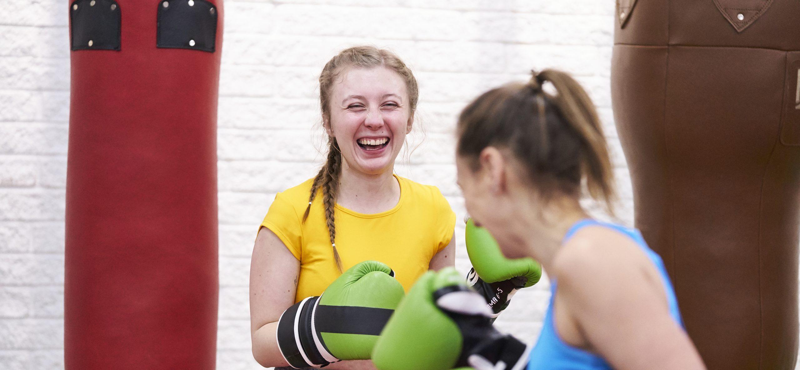 Two white women boxing