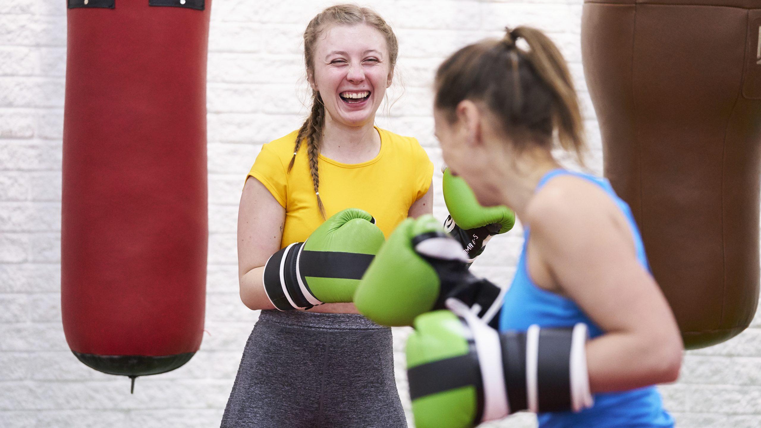 Two white women boxing