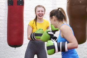 Two white women boxing