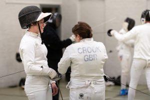 Two women fencing