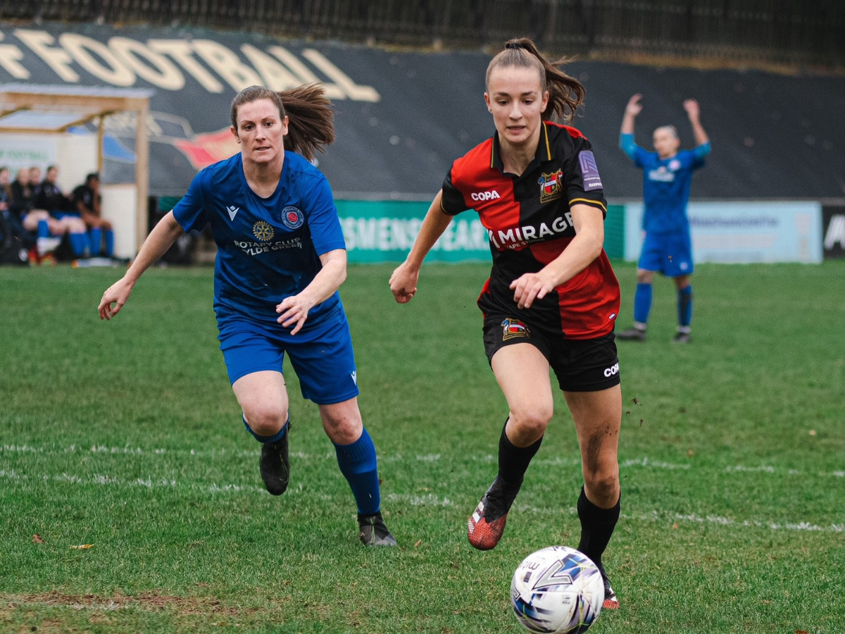 Lauren Evison playing football